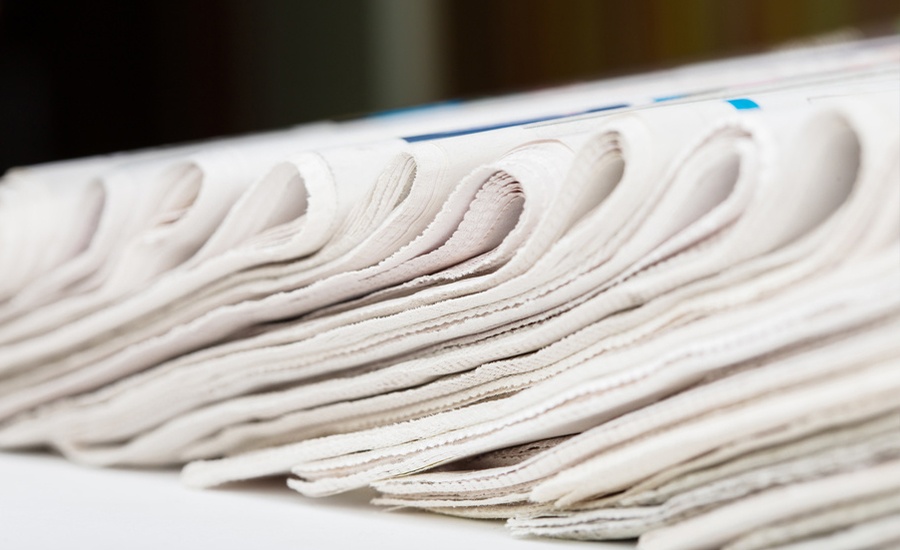folded-newspapers-row